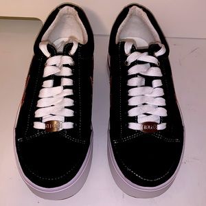 Delia platform tennis shoes. Black suede like feel with red flames. Size 7M